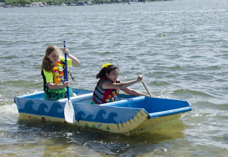 Mia Quinlan and Rosemary Loer made a good showing in their punny rowboat, "ORR's in Motion." BY GEORGIA SPARLING